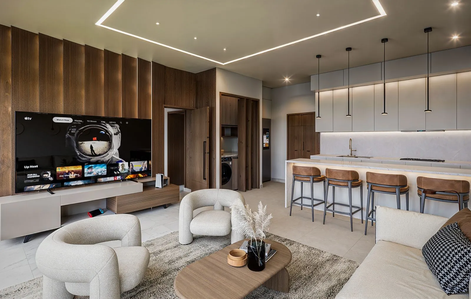 Sala abierta a la cocina con iluminación indirecta